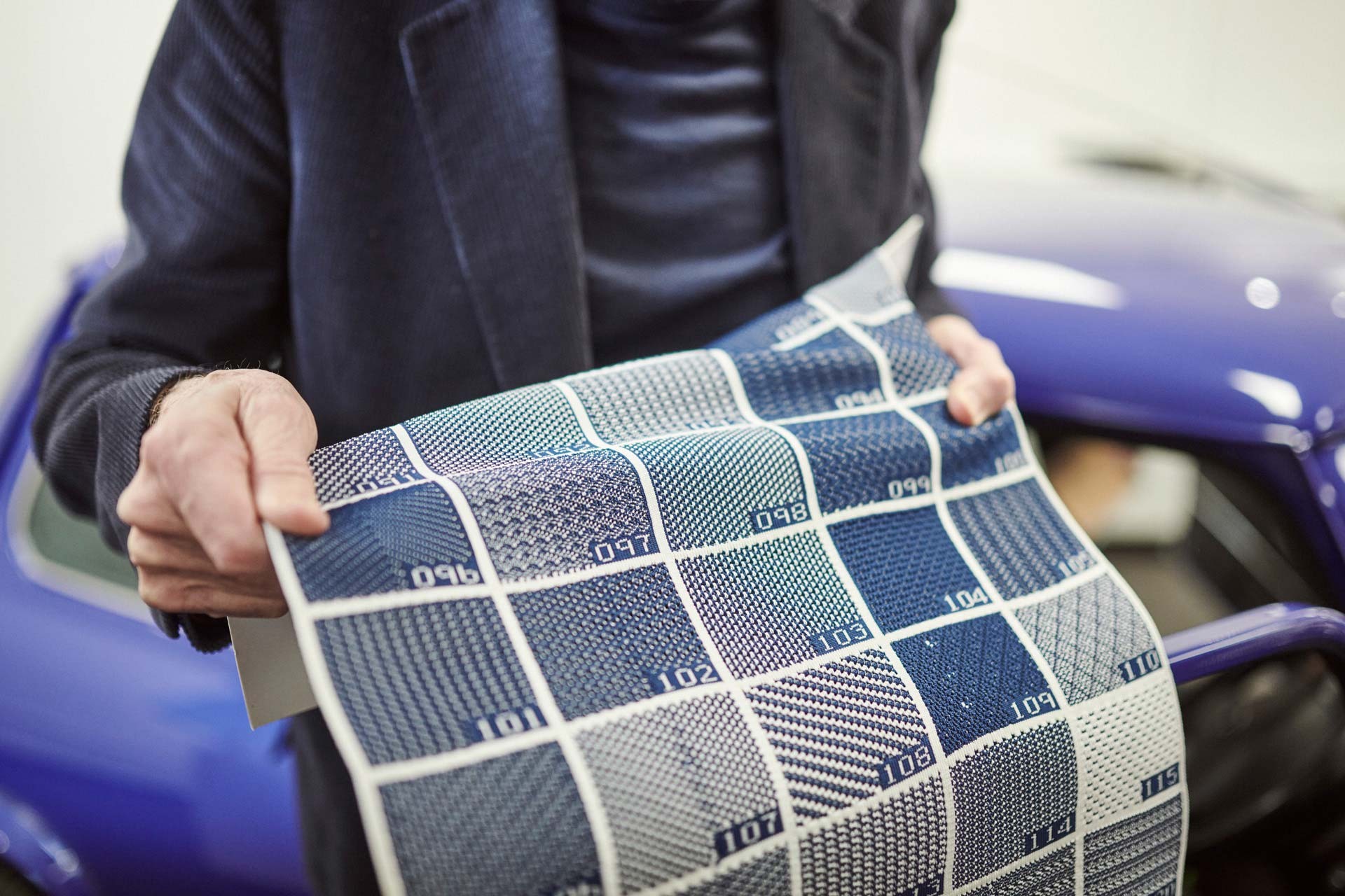 Close-up of Paul Smith in Oxford showing different blue samples from the recycled textiles that replace the old seat covers.